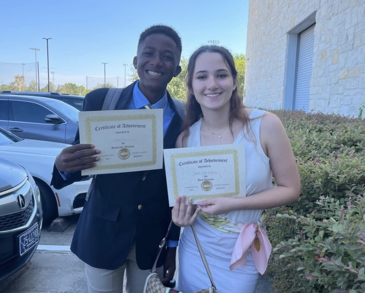 Juniors John Patterson and Sage Barreto smile with their awards at The Emery/Weiner School’s 2023 Model UN Conference.